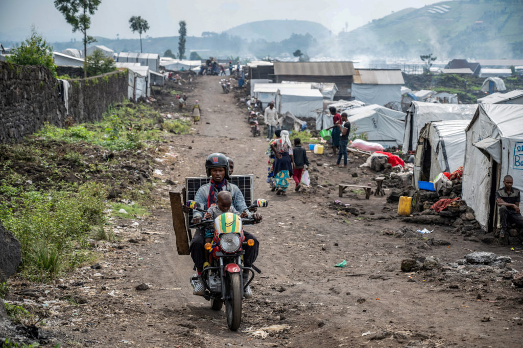 FILE PHOTO: Displaced Congolese people prepare to leave camp as M23 rebels order evacuations near Goma