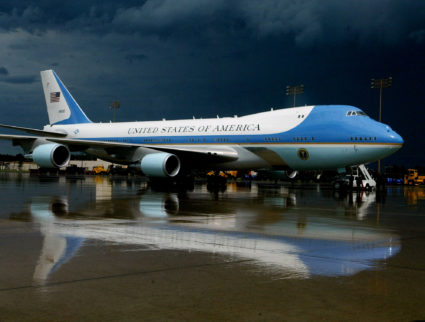 FILE PHOTO: Air Force One is reflected in the rain-soaked tarmac at Sawyer International Airport in Michigan aft..
