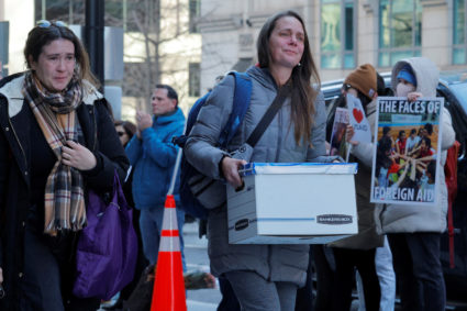 Recently fired USAID staff leave the office in Washington