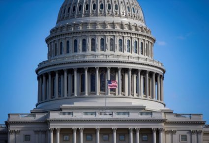 An American flag flies at the U.S. Capitol on day 30 of a partial government shutdown