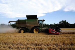 Farmer harvests winter wheat crop in Oklahoma