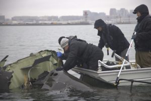 NTSB investigators recover wreckage of the Bombardier CRJ700 and Sikorsky UH-60 Black Hawk mid-air collision from the Poto...