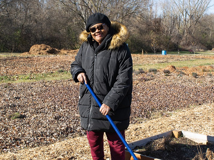 Woman standing in a field farming