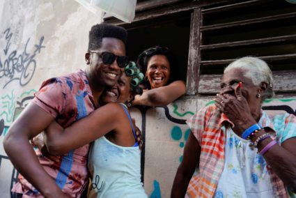 Cuban singer Cimafunk interacts with people on the street during a parade of New Orleans and Cubans musicians in downtown ...