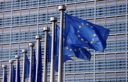 FILE PHOTO: EU flags flutter outside the EU Commission headquarters in Brussels