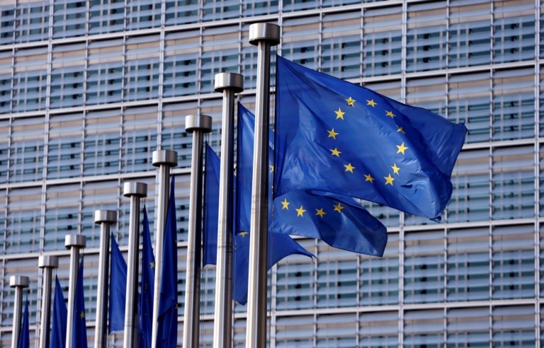 FILE PHOTO: EU flags flutter outside the EU Commission headquarters in Brussels