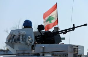 FILE PHOTO: A United Nations peacekeeper (UNIFIL) sits in an armoured vehicle in Naqoura