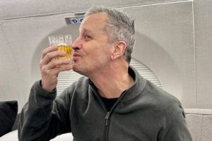 Marc Fogel gestures on an airplane flying him back to the United States