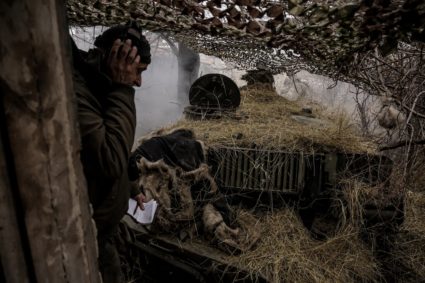 Ukrainian servicemen fire a self-propelled howitzer towards Russian troops at a frontline near the town of Chasiv Yar