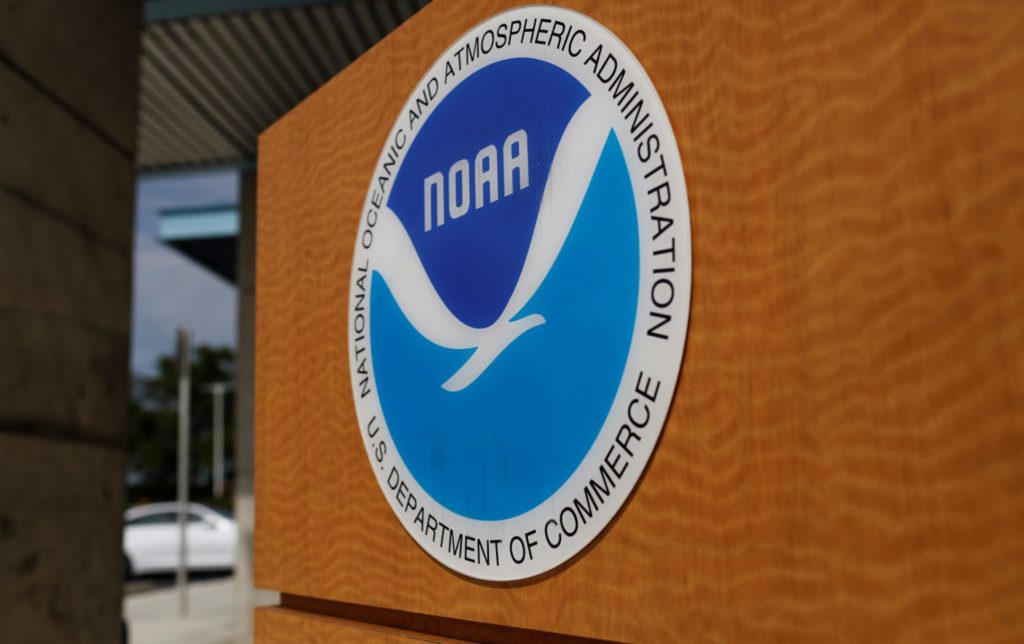 The logo of the National Oceanic and Atmospheric Administration is seen at the National Hurricane Center in Miami