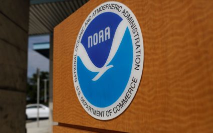 The logo of the National Oceanic and Atmospheric Administration is seen at the National Hurricane Center in Miami