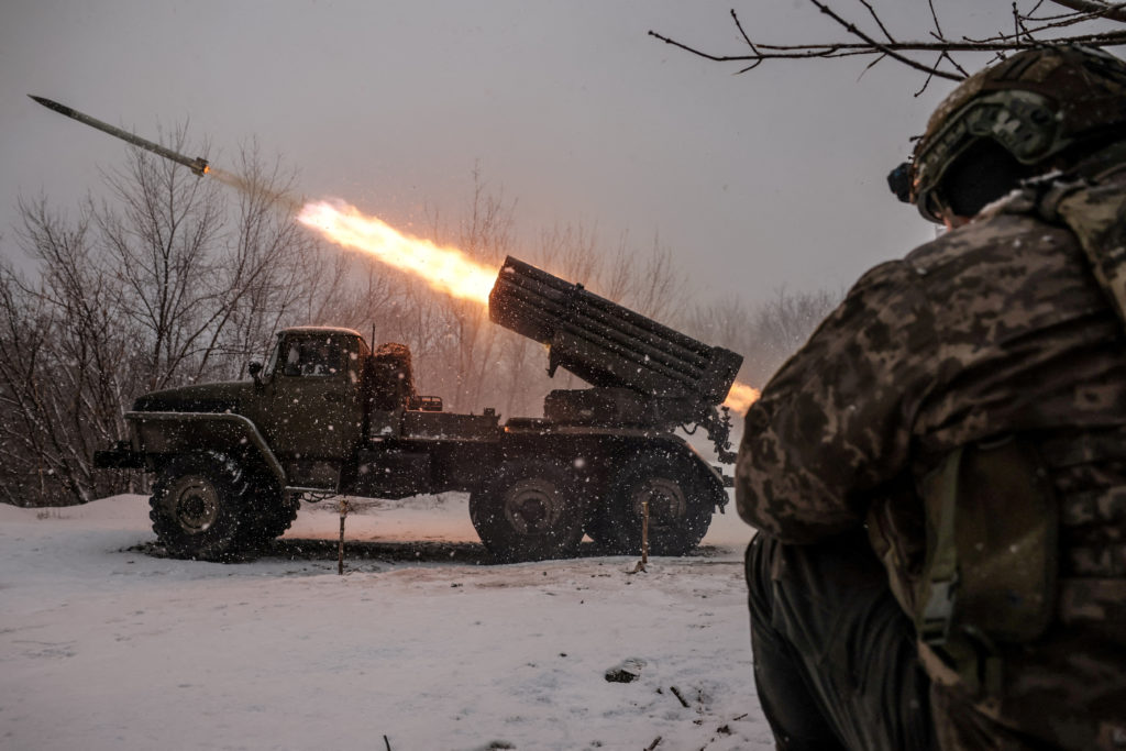 Ukrainian servicemen fire a BM-21 Grad multiple-launch rocket system toward Russian troops on a front line near the town o...