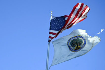 FILE PHOTO: An American flag and U.S. Department of Education flag fly, in Washington