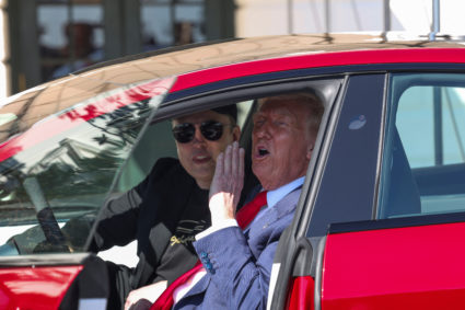U.S. President Donald Trump views a Tesla car at the White House in Washington