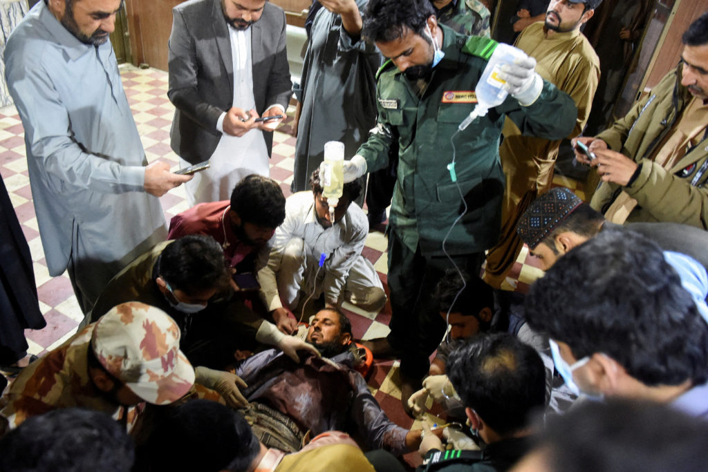 Passenger, who was rescued from a train after it was attacked by separatist militants, receives medical aid at the Mach Ra...