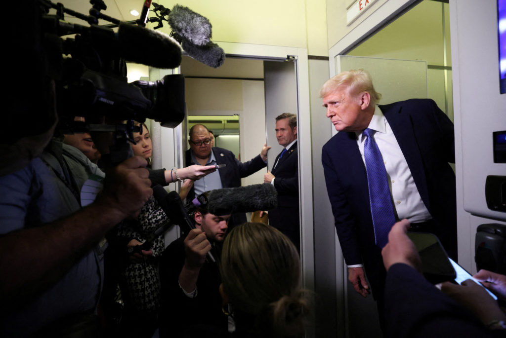 U.S. President Trump speaks to reporters on his return to Washington