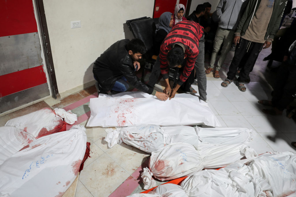 Palestinians mourn loved ones killed in Israeli strikes, in Beit Lahia