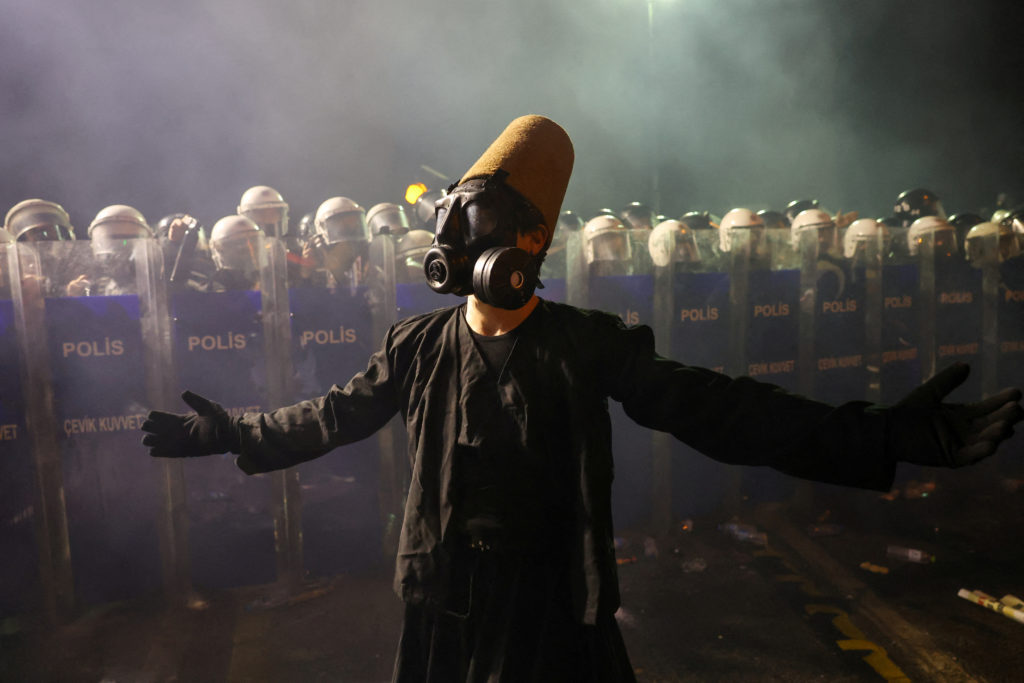 People take part in a protest on the day Istanbul Mayor Ekrem Imamoglu was jailed as part of a corruption investigation, i...