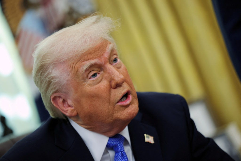 FILE PHOTO: U.S. President Trump delivers remarks with Defense Secretary Hegseth in the Oval Office, at the White House