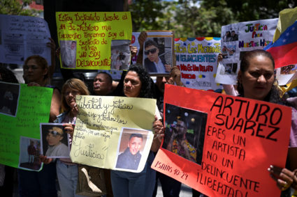 Family members of migrants imprisoned in El Salvador protest to demand their release, in Caracas