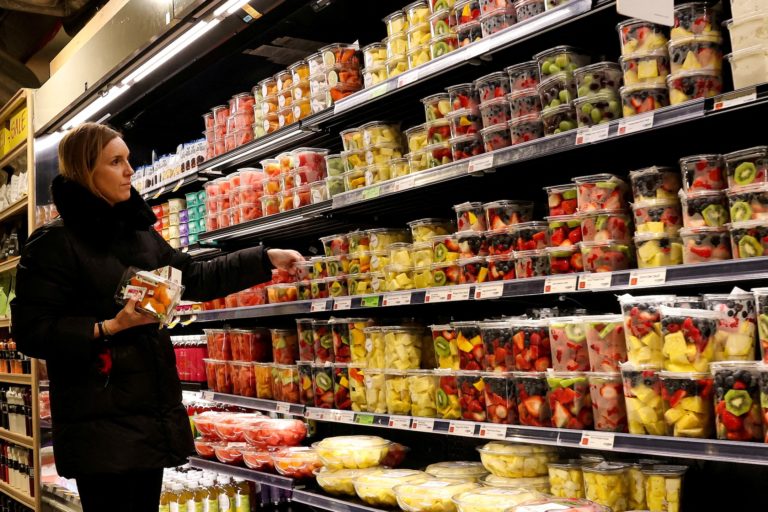 FILE PHOTO: A woman shops for fruit in a store in New York