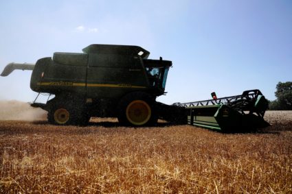 FILE PHOTO: Farmer harvests winter wheat crop in Oklahoma