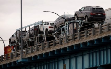 Commercial trucks cross over the Ambassador Bridge from Detroit, Michigan to Windsor, Ontario
