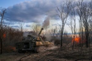 Ukrainian servicemen fires a self-propelled howitzer towards Russian troops in a front line in Kherson region