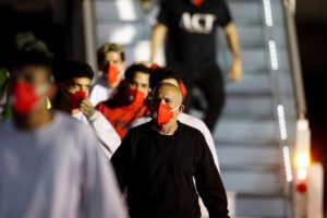 Venezuelan migrants arrive on a flight after being deported from the United States, in Caracas