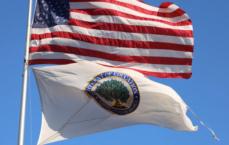 FILE PHOTO: Tattered Department of Education flag in Washington