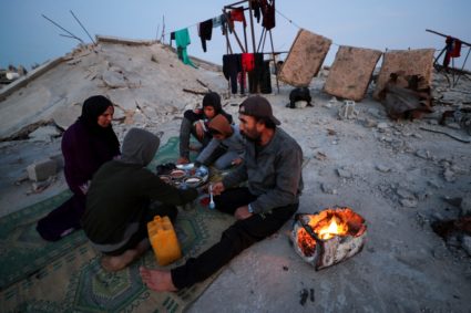 Palestinian family eat the Iftar meals during the holy month of Ramadan, in Jabalia