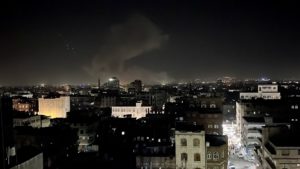 Smoke rises from the site of an air strike in Sanaa