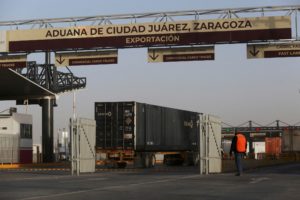 FILE PHOTO: Trucks queue to cross the border between Mexico and the United States