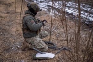 FILE PHOTO: A Ukrainian serviceman of 47th brigade prepares a Starlink satellite internet systems at his positions at a fr...
