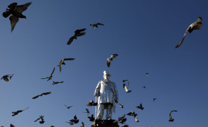 Birds flock around a statue of Boer war leader Paul Kruger at Pretoria's Church Square