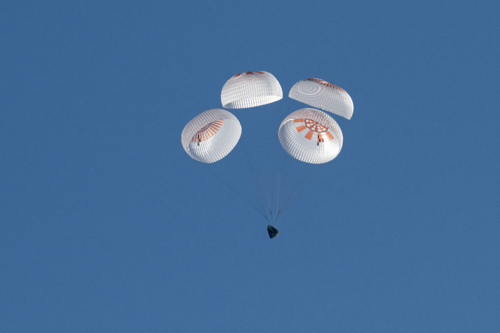 Astronauts Butch Wilmore and Suni Williams return to earth in a Crew Dragon capsule