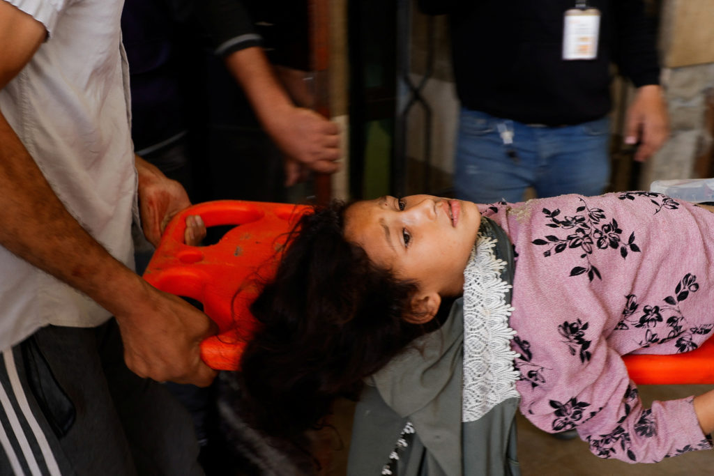 Palestinians wounded in an Israeli strike, at Nasser hospital, in Khan Younis