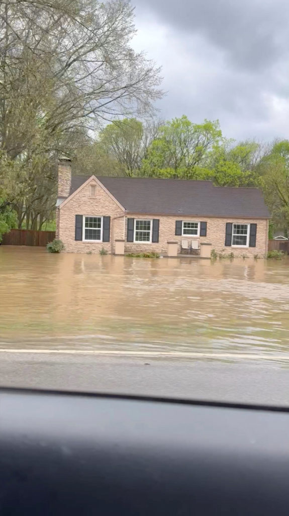 Flood water surround a house following flash floods in Nashville, Tennessee