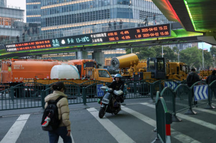 Electronic board shows stock indices in Shanghai