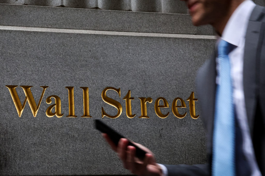 A man walks on Wall St. outside the NYSE in New York