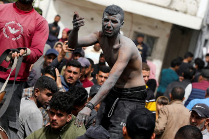 Israeli strike on Gaza apartment building kills at least 23, officials say