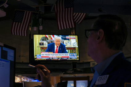 Traders work on the floor of the NYSE in New York