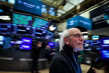 Traders work on the floor of the NYSE in New York