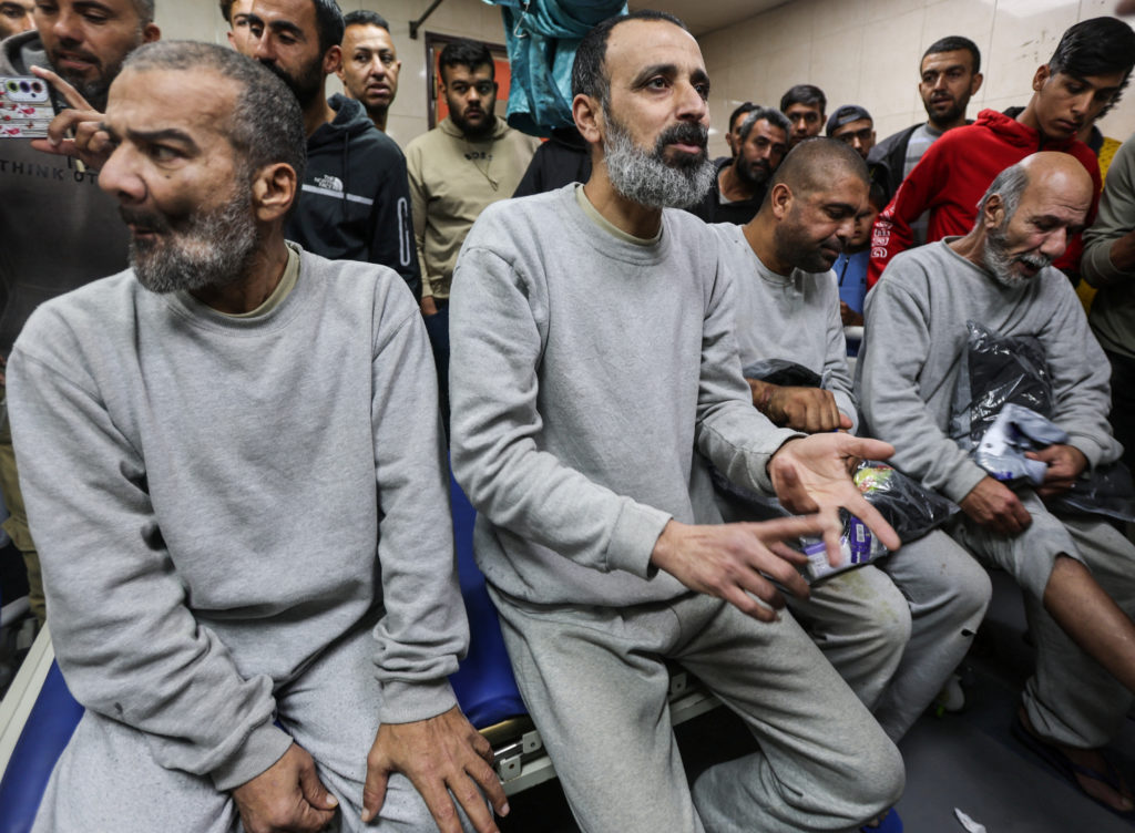 Palestinians, who were detained by Israel, arrive at Al-Aqsa Martyrs hospital after their release, in Deir Al-Balah