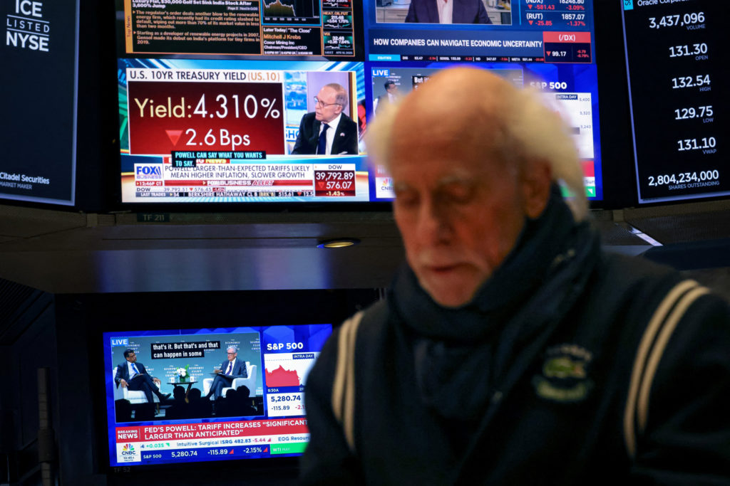 Traders work on the floor of the NYSE in New York