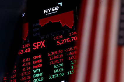 A screen charts trading numbers on the floor at the NYSE in New York