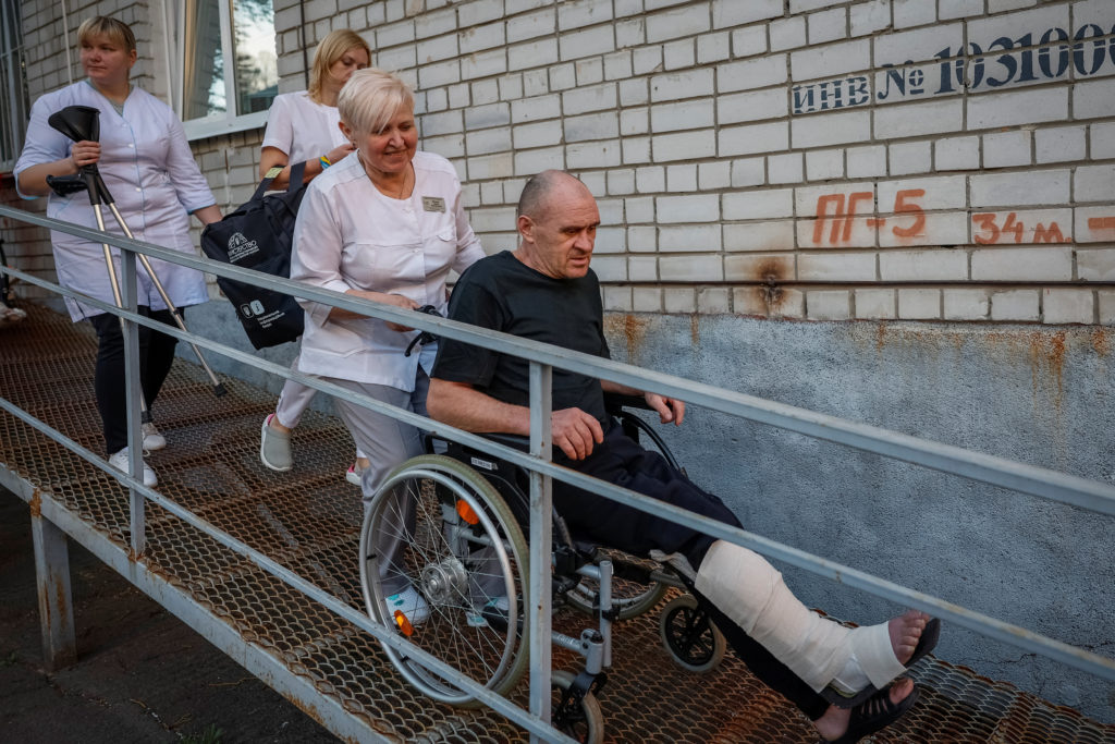 Ukrainian prisoners of war (POWs) return after a swap, in an undisclosed location