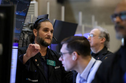 Traders work on the floor of the NYSE in New York