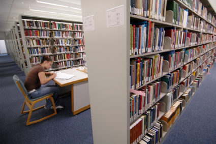 DENVER, CO, SEPTEMBER 12, 2006--Jimica Perea studies for a Philosophy class at the Regis University library recently. Jimi...