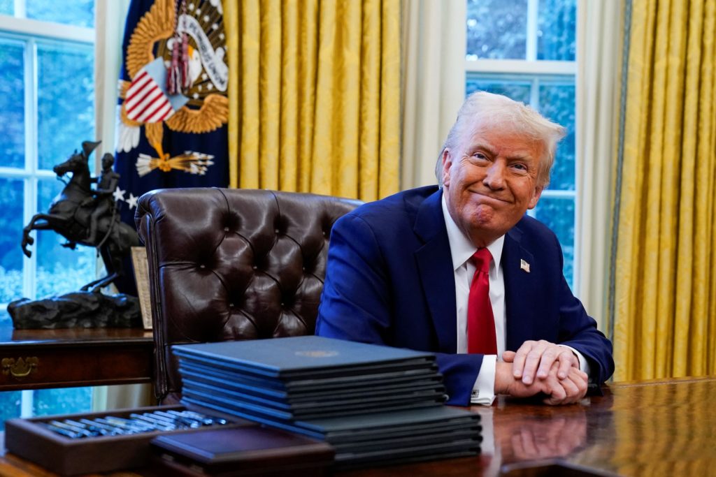 U.S. President Donald Trump reacts at the White House